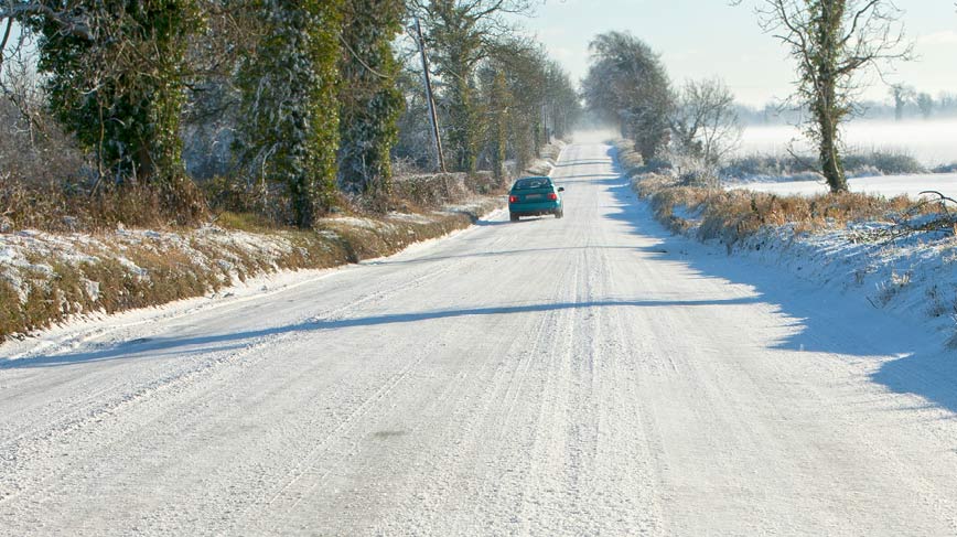 Car on snowy country road