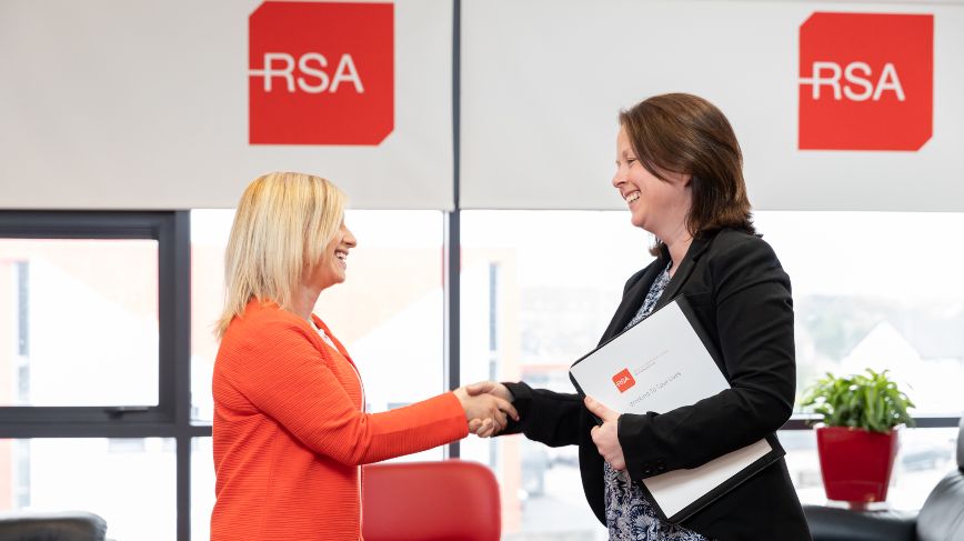 Two RSA employees shaking hands